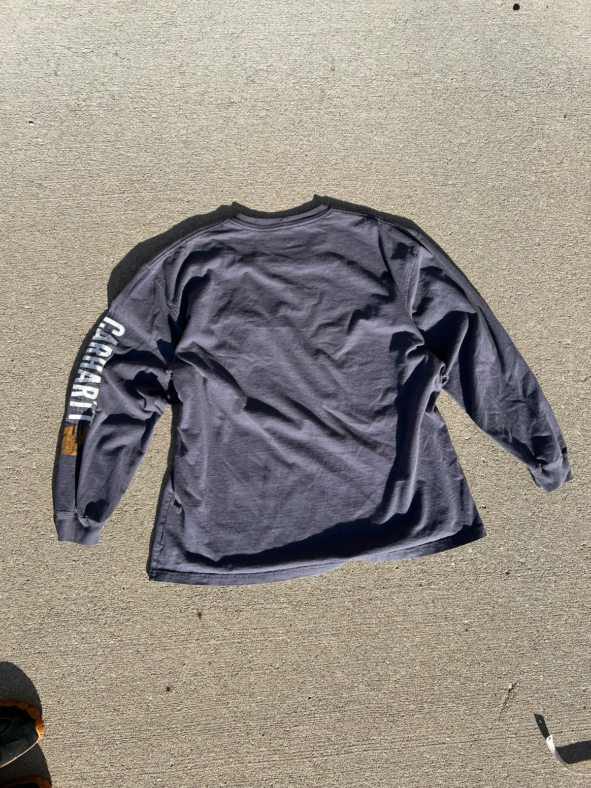 One of one long sleeve pocket tee